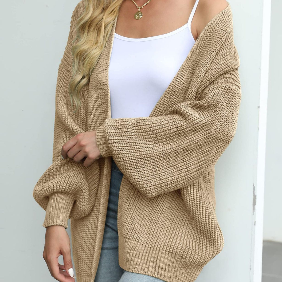 Knitted cardigan for women with long lantern sleeves
