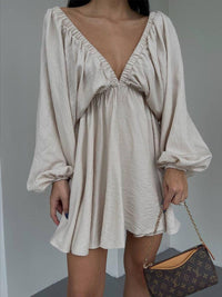 Mini skater dress made of fabric with deep neckline
